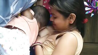 mom giving milk to his little son