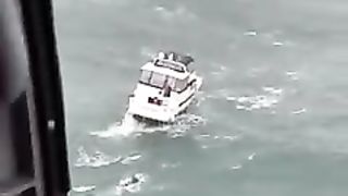 Massive wave wipes out boat during Coast Guard rescue.