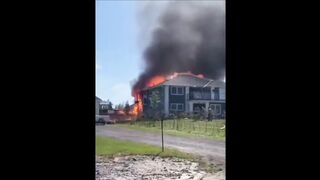 400 pound propane tank explodes just as firefighters start to approach the rear of a house fire