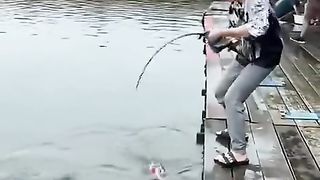 back looking for fishing fish in the pond