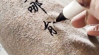 Painter writes on dusty trousers in one smooth stroke