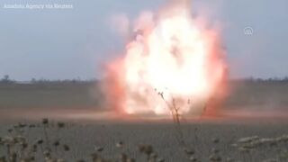 Ukrainian mine disposal team work to uncover and clear mines in Mykolaiv