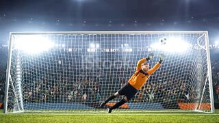 Goalkeeper jumps and fails