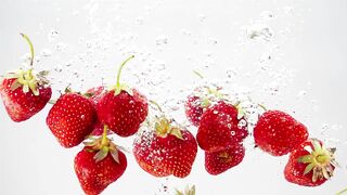 A Bunch Of Strawberries Falling Through Water | Free Stock Video Footage