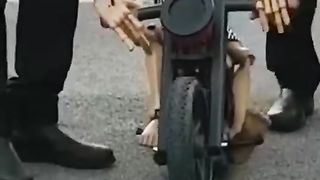 Puppet on a motorcycle.
