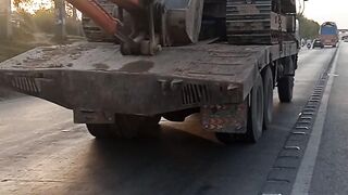 Hitachi excavator load on long truck