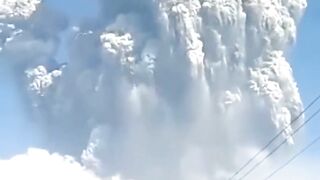 Indonesia's Merapi volcano erupts again! Volcanic ash covers houses and road.