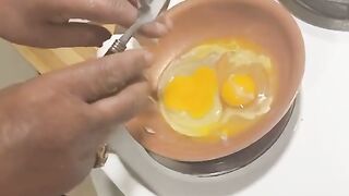 Crack an egg with a spoon but he get yelled at