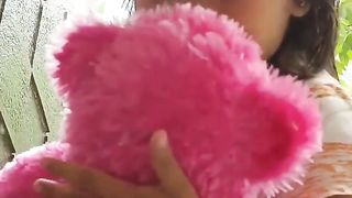 yumna plays with teddy bear