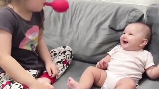 cute baby play with elder sister