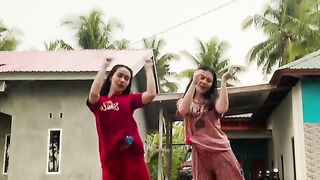 Two young women dancing????