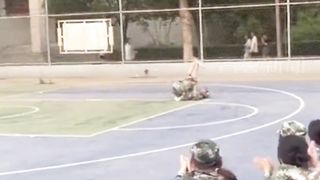 Performing Chinese Kung Fu during the gap between military training in Anyang, Henan Province