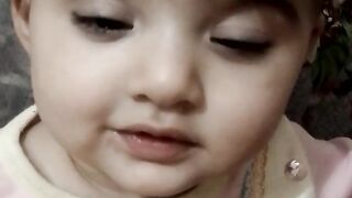 Cute baby wearing traditional hat