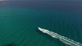 Speed boating in clear waters