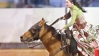 WOMAN SHOOTER ON HORSE..
