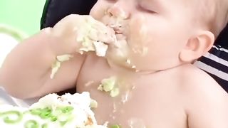 Cute baby eat cake