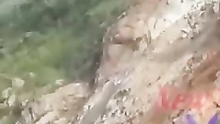The car was almost hit by a rock