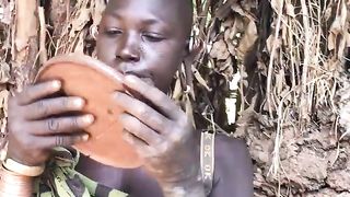 The lady from suri tribe inserting lip plate 2
