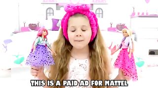 Diana and Roma playing with barbie doll