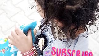Hearts touching... little girl selling some things