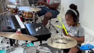 DAD AND DOUGHTER PLAYING MUSIC