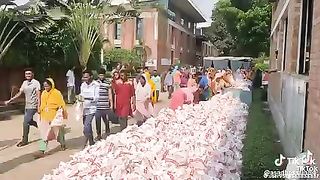 Bangladeshis taking meat outside of the markets after the shopping on the occassion of the Eid Ul Azha..