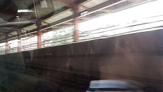 Metro train come out of tunnel near aeroplane...