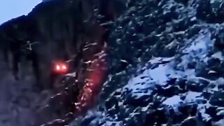 Mysterious Apparition of two fire lights descending the mountain