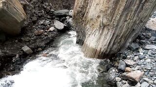 Standing stone on river
