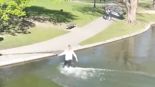 Skimboarding Across the Boston Commons Pond_