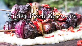 cooking pork skewers in the forest