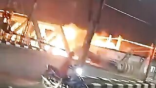 a violent explosion when a broken down truck was hit by a train on a railroad crossing