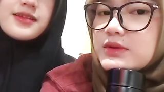 Two beautiful muslim women recite arabic song ell kalam