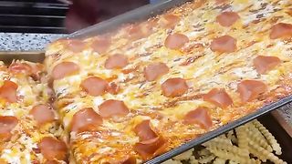 cheesy pepperoni poured over crinkle cut fries