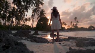 Lonely Girl Walking on Beach at Sunset