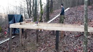 a man build a wonderfull house alone in the forest