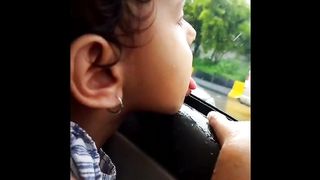 cute baby trying to drink rain water