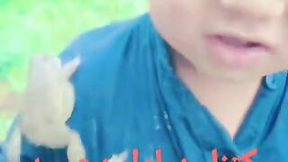 So cute & innocent child with frog in pocket