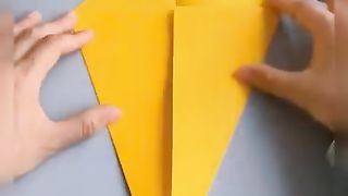 Creating a fish using a square piece of paper.