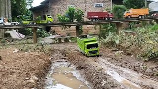 Remote control dump truck picks up a load of sand