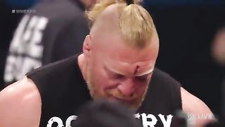Brock_Lesnar_smashes_Cody_Rhodes_through_the_announce_table__#