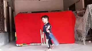 Small baby play cricketing shot