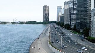 Drone Footage of Traffic on a Coastal City Highway