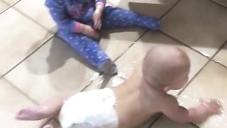 uh no baby playing with oil