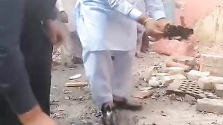 Tears flow as Holy Bible Rescued from Burning church in Jaranwala Faislabad