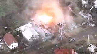 Ukrainian soldiers come under artillery fire driving through a village in the DPR front