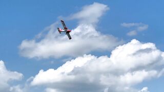 A Light Aircraft Flying Across The Sky