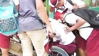 Elementary school children go home on modified motorbikes