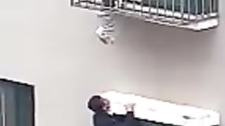 Neighbours rescue boy dangling from 4th-floor window in China