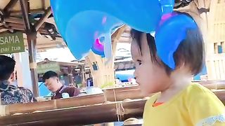 My Child is Playing with Shark Balloons
